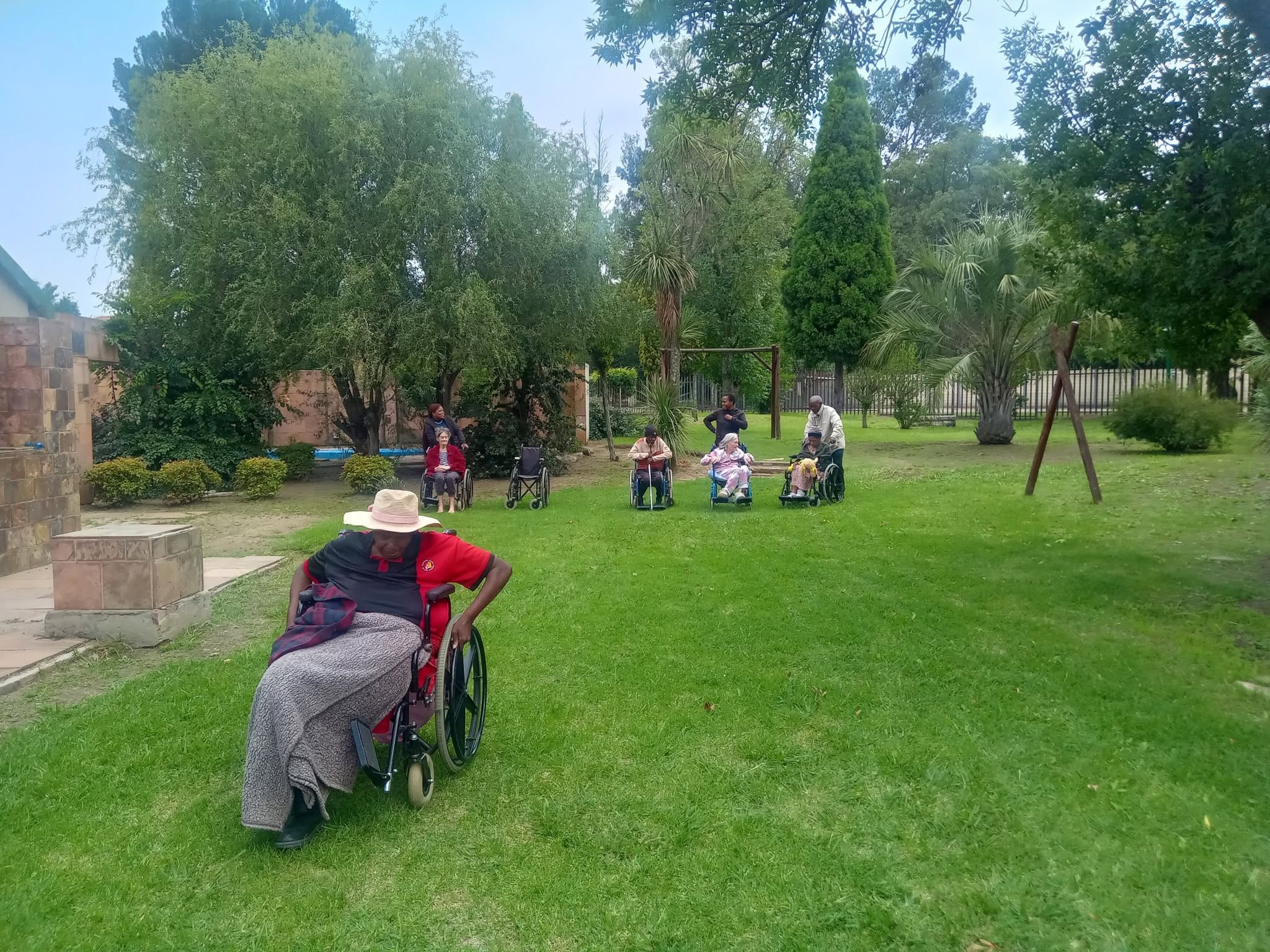 Residents enjoying the garden at Maria Old Age Home